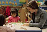 Meghan MacKinnon works with young children at ECDC 