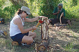 Chevonn Fant chopping wood in aboriginal village