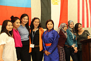 Participants of an international women's leadership program at Saint Mary's gather in front of the flags of their countries. Funded by a grant from the U.S. Department of State, the program hosted students from five countries.