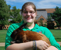 Mara Scott '13 with her rabbit Rose.