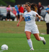 Mollie Valencia looks to push the ball forward against Alma.