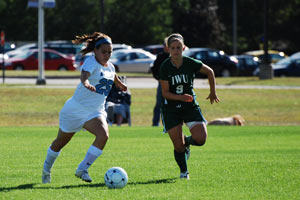 Ashley, left, plays forward for the Saint Mary's Belles soccer team.