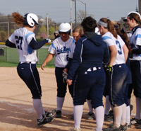 Morgan Bedan steps on home plate after hitting a two-run home run against Carthage.