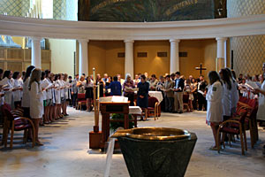 Saint Mary's student nurses, nursing professors, and audience members sing during the annual Nurses Pinning Ceremony in the Church of Our Lady of Loretto.