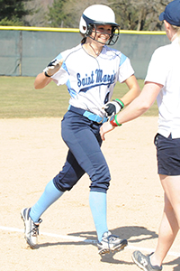 Makenzie Duncan rounds third after hitting a home run in game one.