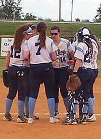 The Belles huddle up in their second win of the day. (Photo courtesy of  Jeff Garving, Heidelberg Director of Athletic Marketing and Information)