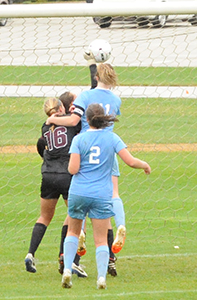 Mary Kate Hussey heads the game-winner in against Calvin.