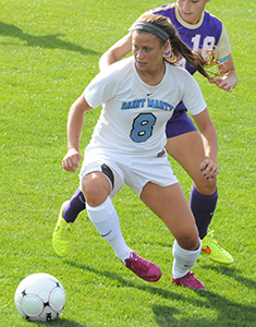 Jenn Jarmy looks to pass while keeping possession against Albion.