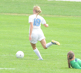 Maggie McLaughlin shoots the game-winner in overtime against Mount St. Joseph.