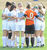 Saint Mary's soccer team in huddle and earned the fourth place in the 2014 MIAA Women's Soccer Preseason Poll