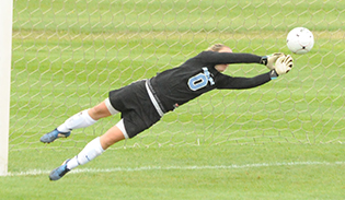 Chanler Rosenbaum makes one of her eight saves against Alma.