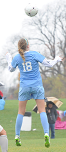 Maggie McLaughlin goes up to head the ball against Adrian.