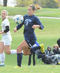 Rzepecki receives Cusick's pass before scoring in the first half.