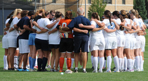 The team huddles up just before kickoff against Bethel.