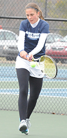 Andrea Fetters connects on a backhand return in her one singles match.