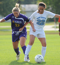 Mollie Valencia battles with Albion's Lindsey Lubanski in the midfield.