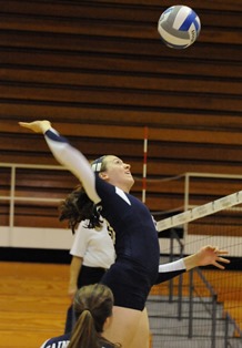 Leah Buck goes up in the third set for one of her eight kills.