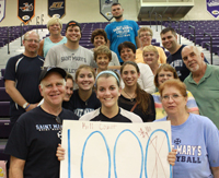 Kati Schneider celebrates her 1,000th kill with her family on Friday.