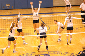 The Belles celebrate after winning match point against Kalamazoo.