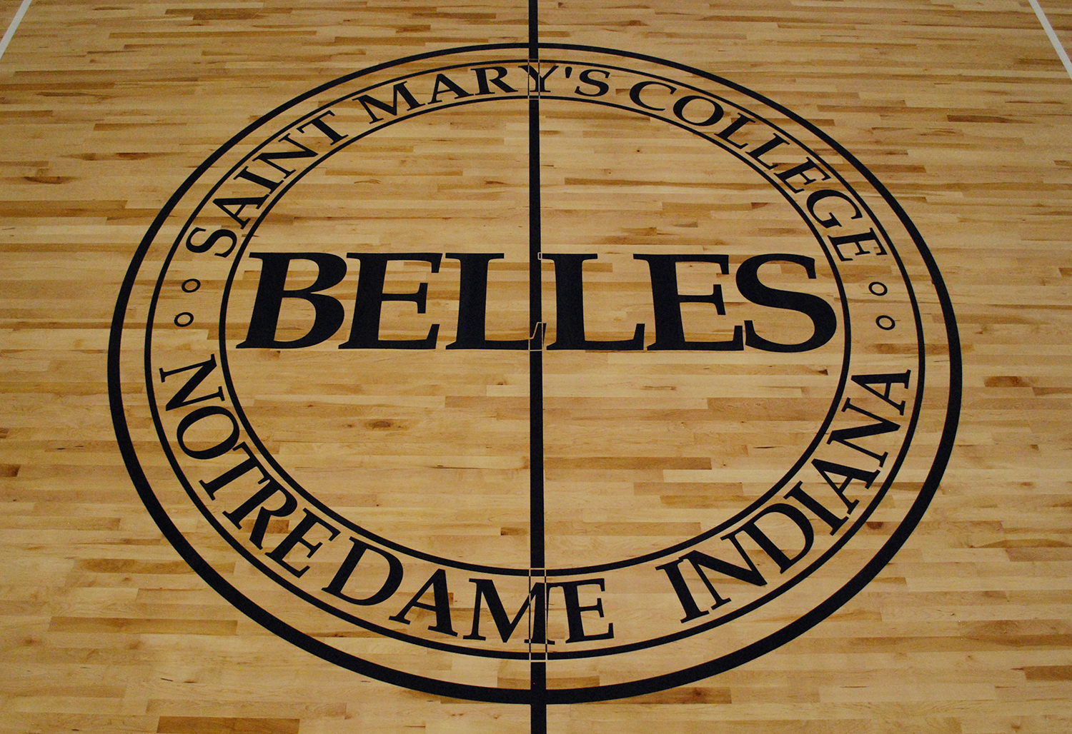 Basketball performance court floor with Saint Mary