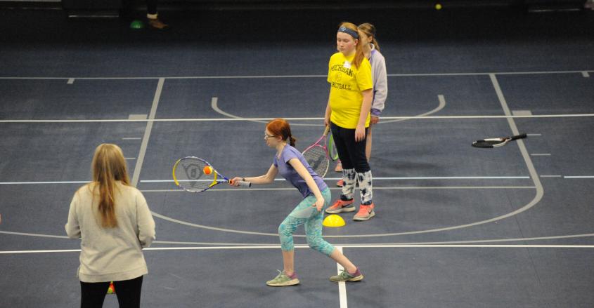 Students playing tennis