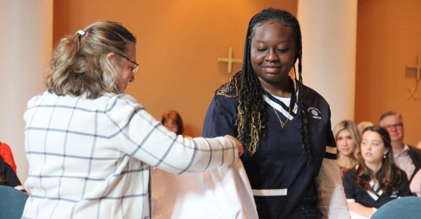 Student is dressed in white coat