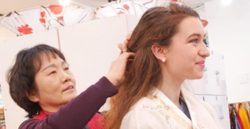 Student with woman who helped fix hair and explain traditional Hanbok. 