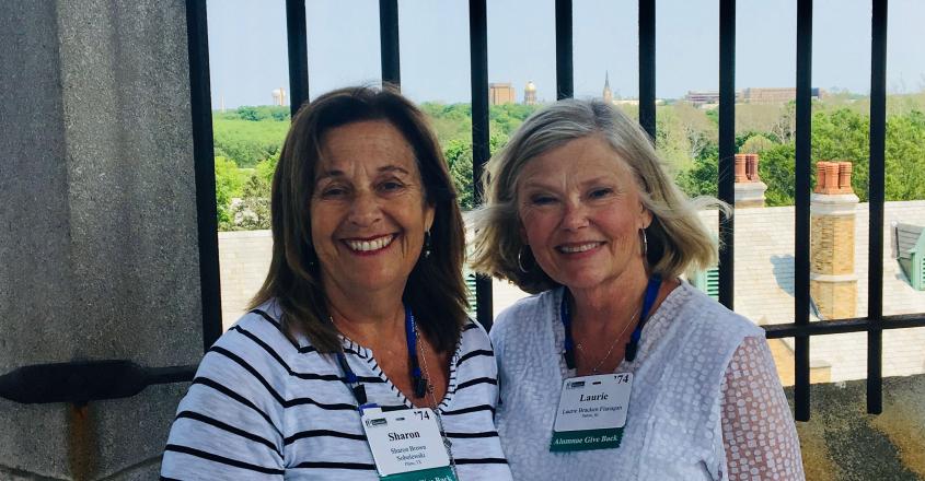 Class of ’74 roommates Sharon Brown Sobolewski (L) and Laurie Bracken Flanagan (R) enjoy the spectacular views from the Le Mans Bell Tower during their tour Reunion Weekend.